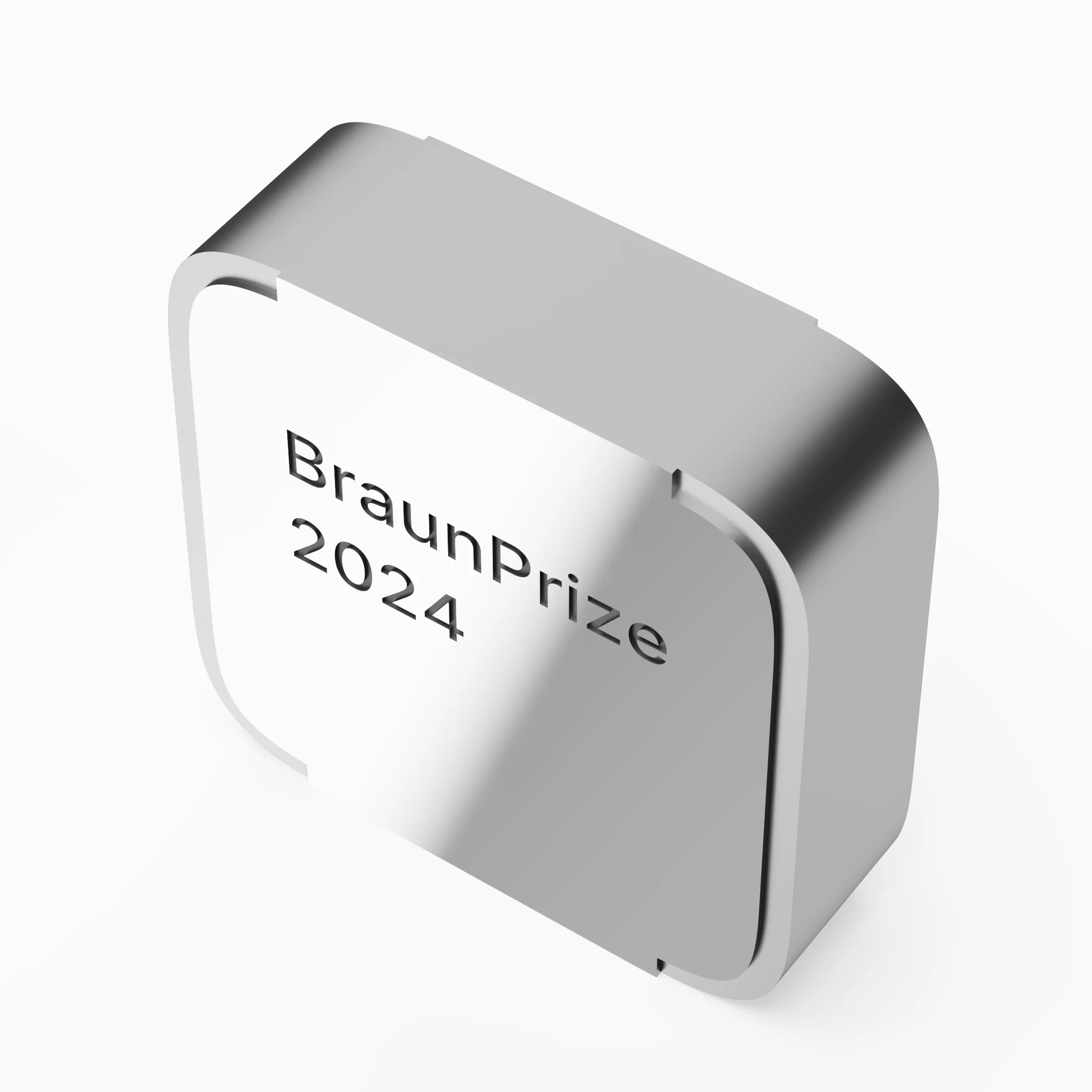 Angled view of the BraunPrize 2024 trophy, showing the curved edges and recessed front face.